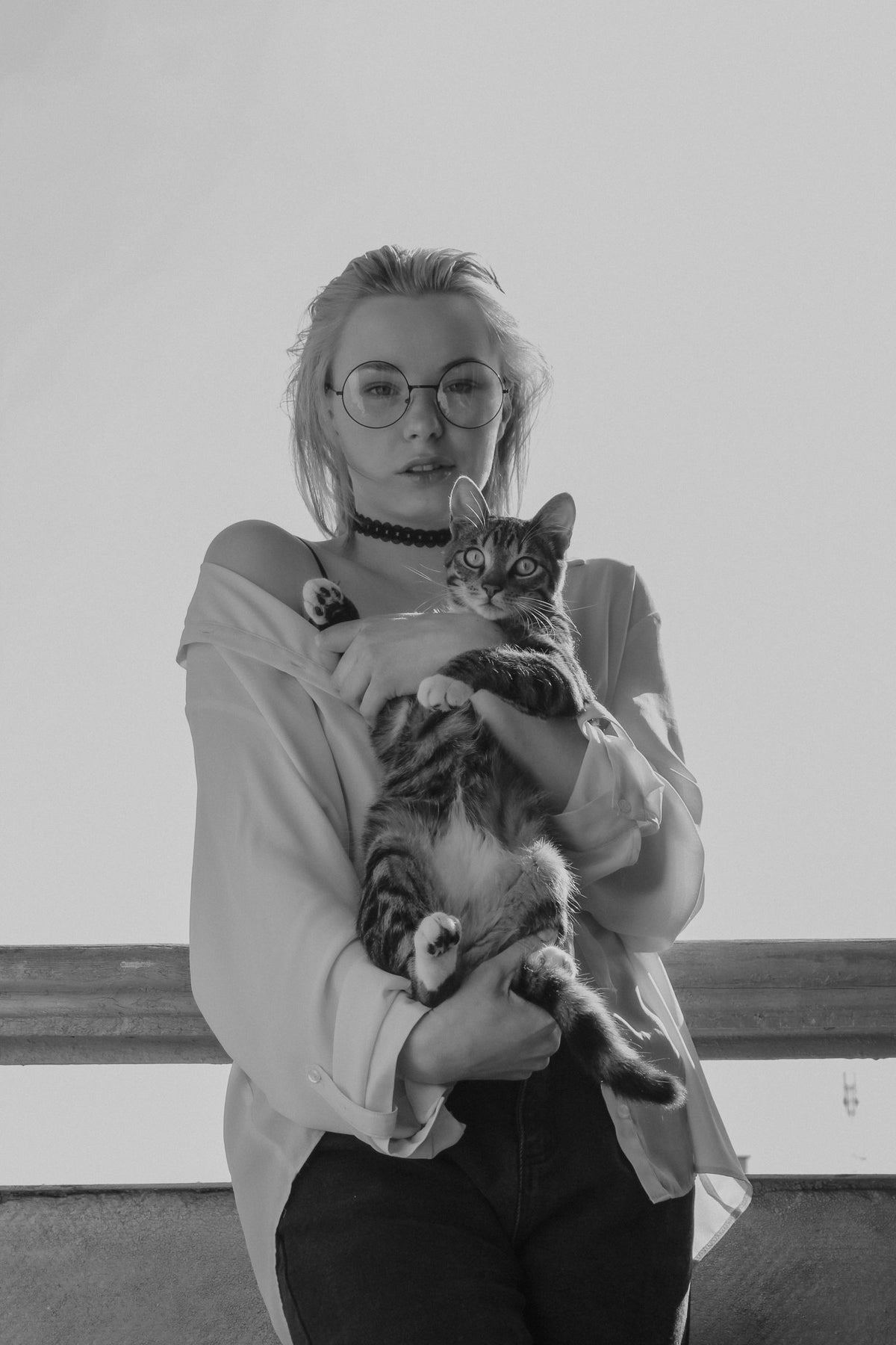 A person holding their cat close